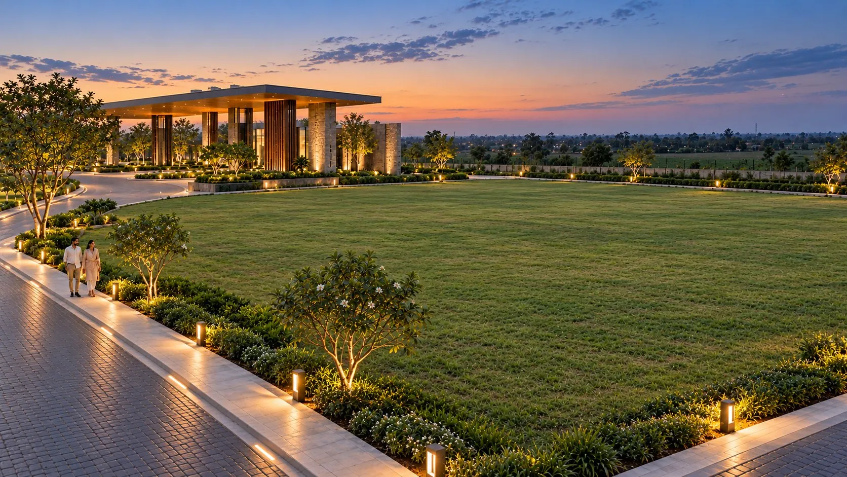 Concept visualisation of an open residential plot edged by flowering planting and a lit walkway at dusk, with a couple strolling and the club pavilion beyond